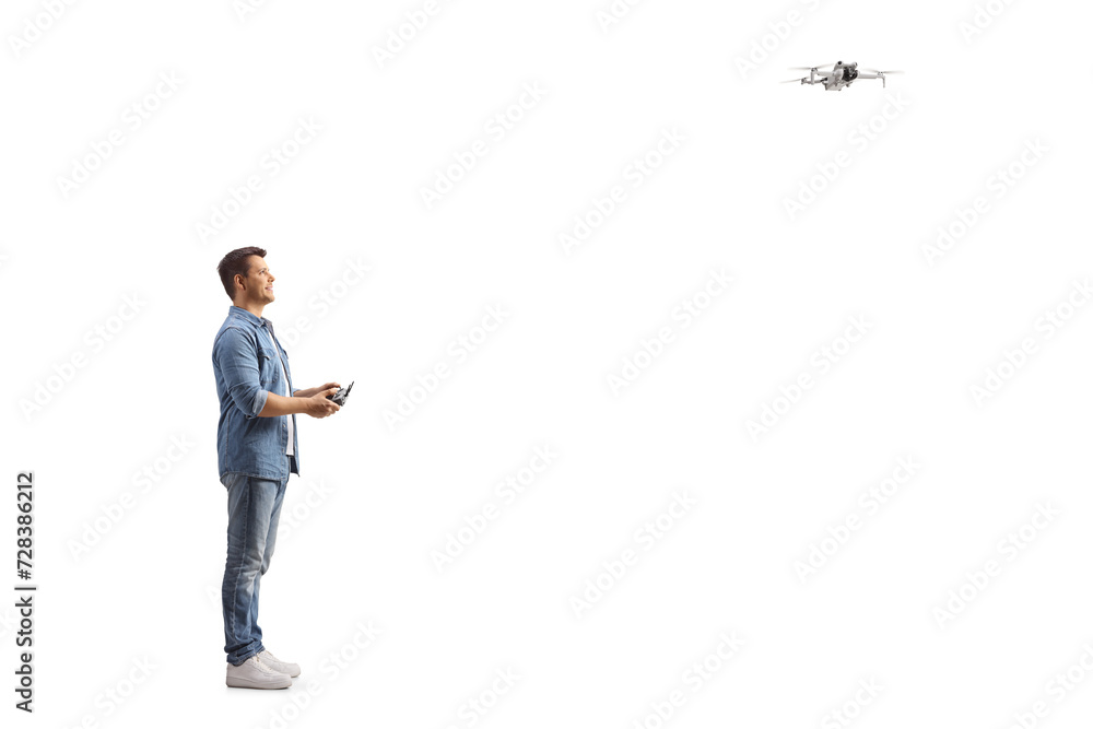 Man flying a drone with a cotroller Man flying a drone with a cotroller