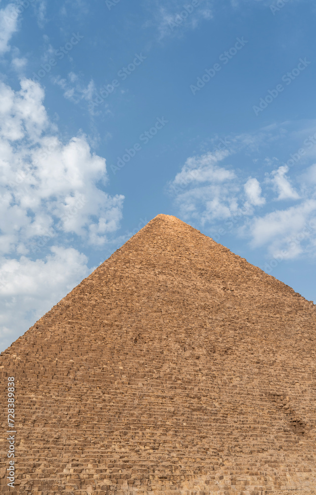 Egyptian pyramid top against the sky