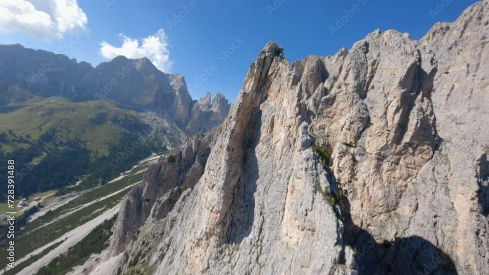 FPV drone following sharp rocky ridge of the Italian Dolomite majestic mountain range FPV drone following sharp rocky ridge of the Italian Dolomite majestic mountain range