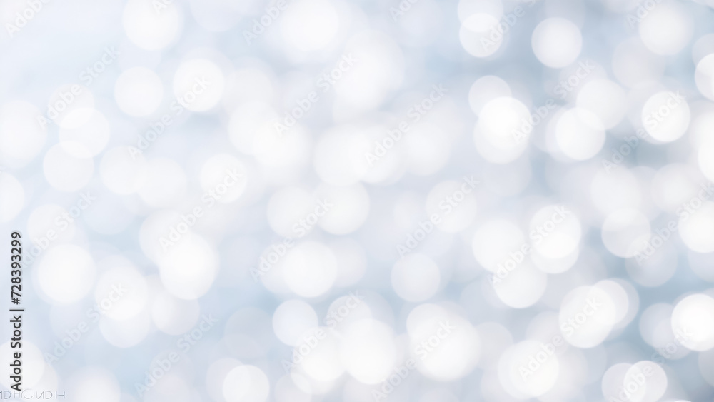 white and silver bokeh background with a hint of blue.