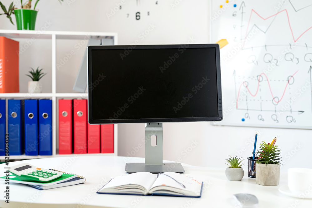 Office interior desk with pc computer laptop pen notepad whiteboard Office interior desk with pc computer laptop pen notepad whiteboard