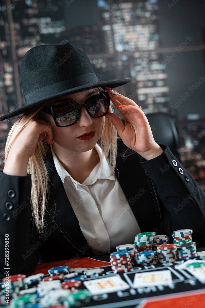 portrait of young caucasian woman with cards and chips playing poker at casino portrait of young caucasian woman with cards and chips playing poker at casino