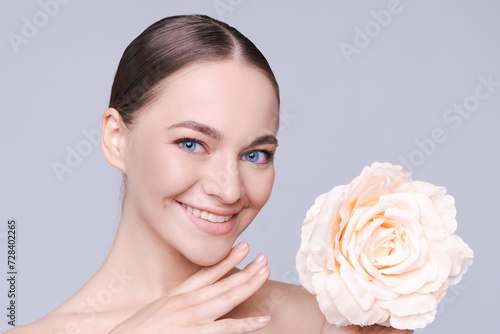 Skincare  flower and beauty portrait woman for dermatology  makeup and cosmetics. Facial  wellness and self care for skin glow  floral product and happy face natural model in studio
