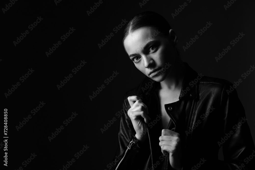 black and white Portrait young beautiful woman with black leather jacket.