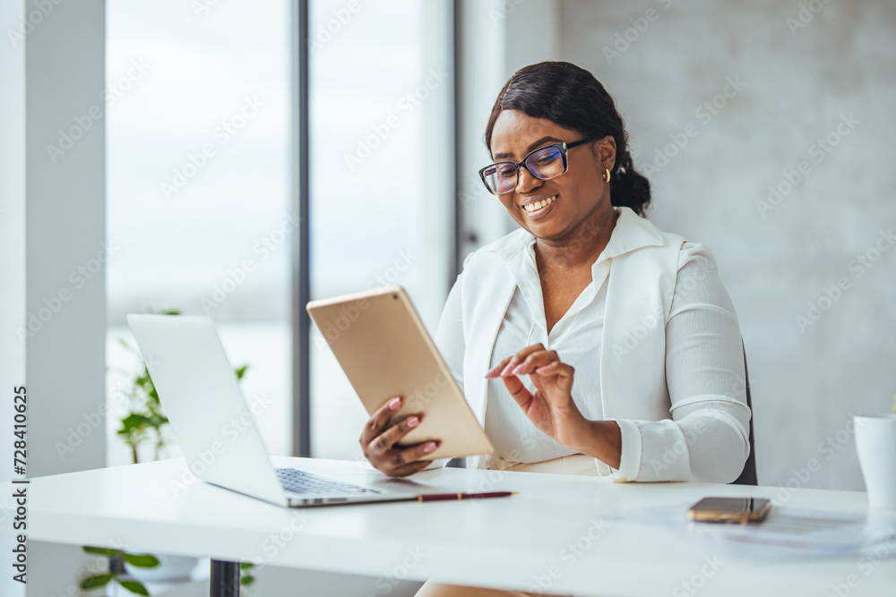 Thinking about how to take the business to technological heights. Cropped shot of an attractive young businesswoman working in her office. Young businesswoman using digital tablet Thinking about how to take the business to technological heights. Cropped shot of an attractive young businesswoman working in her office. Young businesswoman using digital tablet
