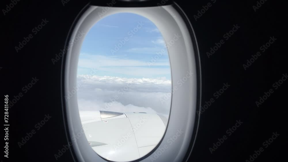 Flying Over White Clouds, View From Airplane Window - POV Flying Over White Clouds, View From Airplane Window - POV