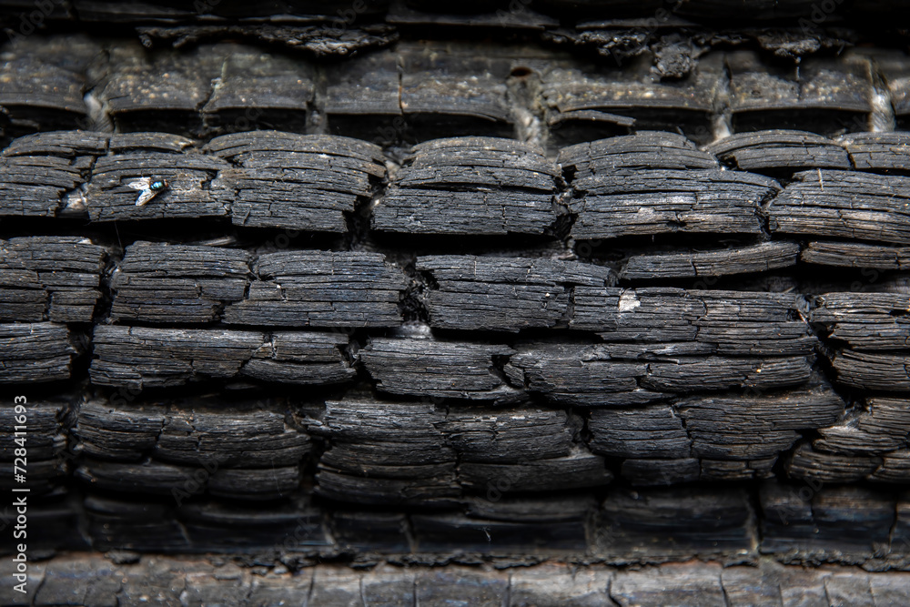 Charred wooden logs of a barn, bathhouse, house after a fire. Charred wooden logs of a barn, bathhouse, house after a fire.