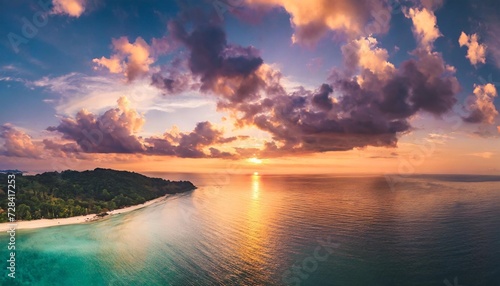 aerial panoramic view of sunset over ocean colorful sky clouds water beautiful serene scene wide angle seascape drone view majestic stunning nature background best sea sky sunrise inspire views © Debbie