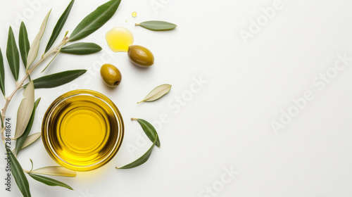 olive oil and olive branch on a white background top view copy space