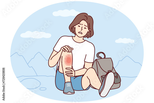 Weakened woman sits on ground with fear looks at wound on leg after fall during walk. Traveler girl was injured during hike and needs healing ointment or dressing of fracture site. Flat vector image