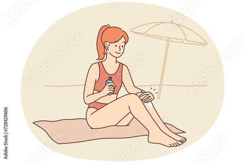 Smiling woman apply sunscreen sunbathing on beach
