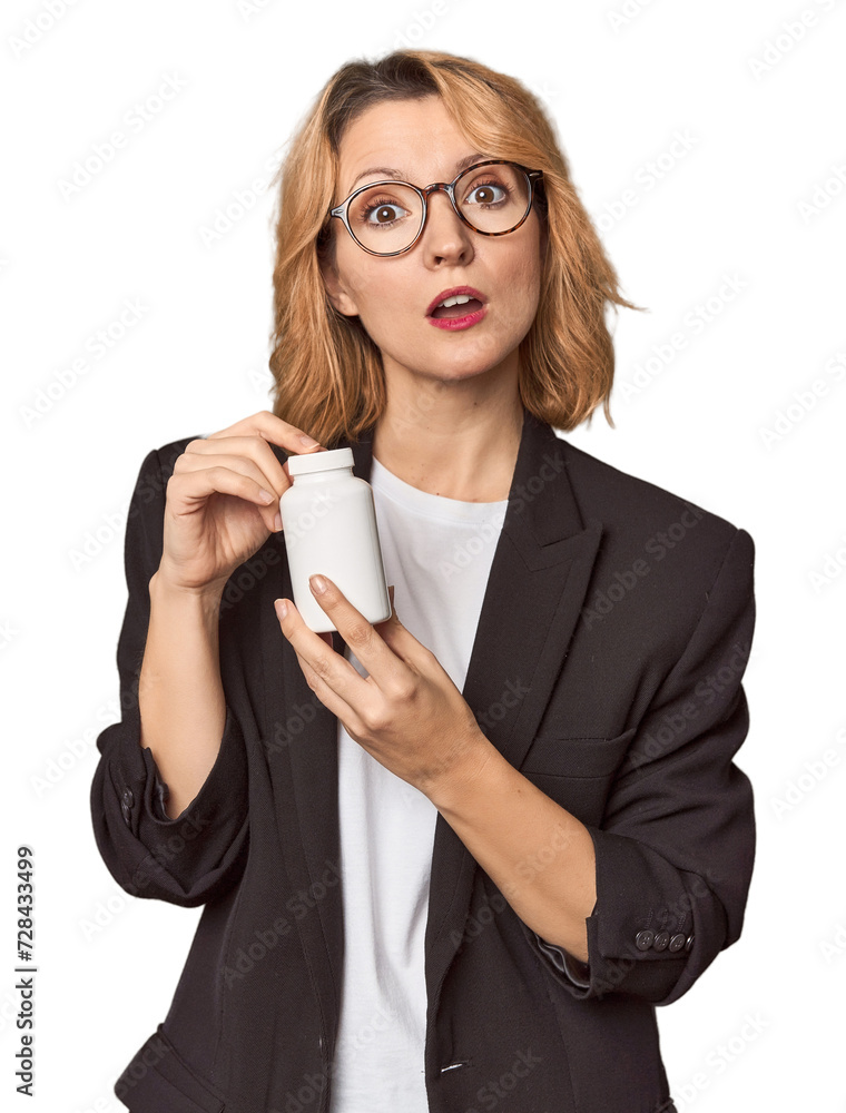 Caucasian middle-aged businesswoman with pills in studio Caucasian middle-aged businesswoman with pills in studio