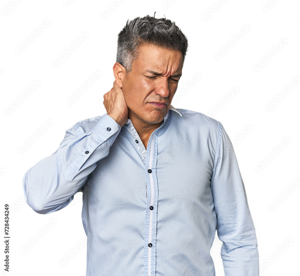 Middle-aged Latino man having a neck pain due to stress, massaging and touching it with hand.