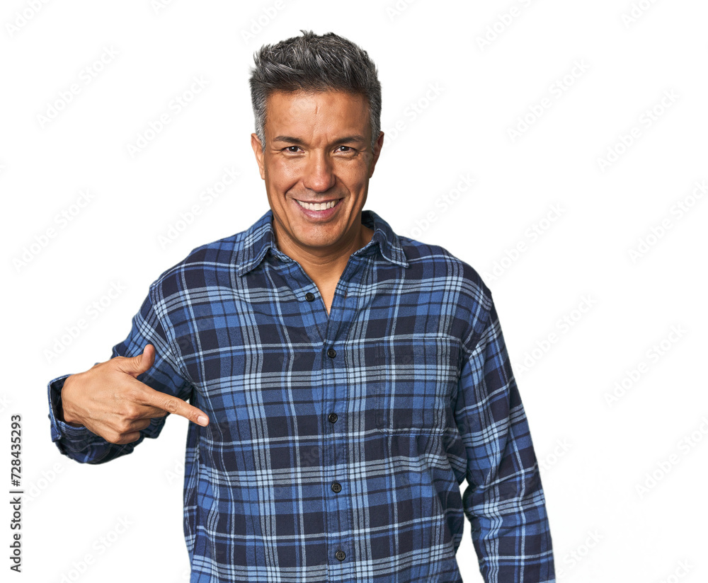 Middle-aged Latino man person pointing by hand to a shirt copy space, proud and confident Middle-aged Latino man person pointing by hand to a shirt copy space, proud and confident