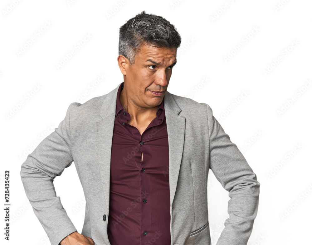 Middle-aged Latino man confused, feels doubtful and unsure. Middle-aged Latino man confused, feels doubtful and unsure.