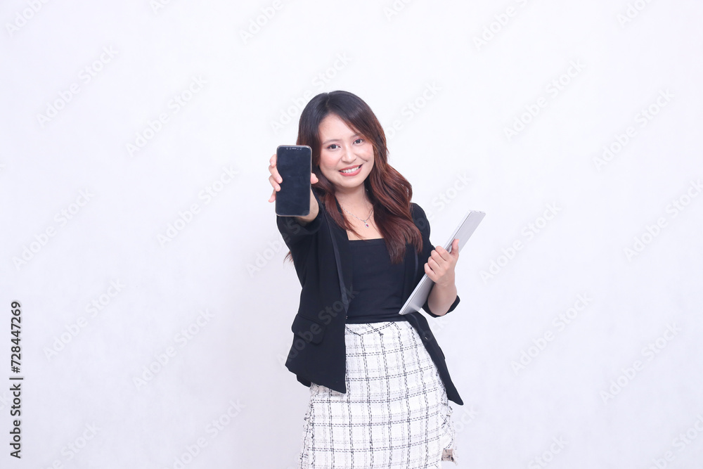 beautiful southeast asian woman 20s formal office big smile looking at cell phone gadget screen in front and carrying tablet for promo isolated white background beautiful southeast asian woman 20s formal office big smile looking at cell phone gadget screen in front and carrying tablet for promo isolated white background