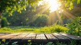 Wooden table in the park with sun light and green nature background