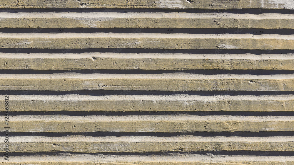 Old weathered surface with striped relief on the street