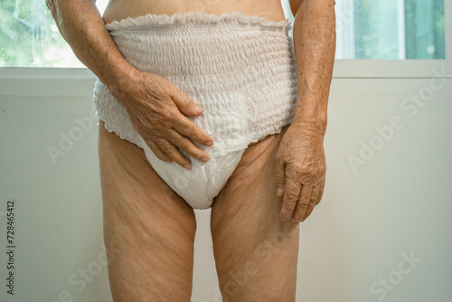 Asian senior woman patient wearing incontinence diaper in hospital, healthy strong medical concept.