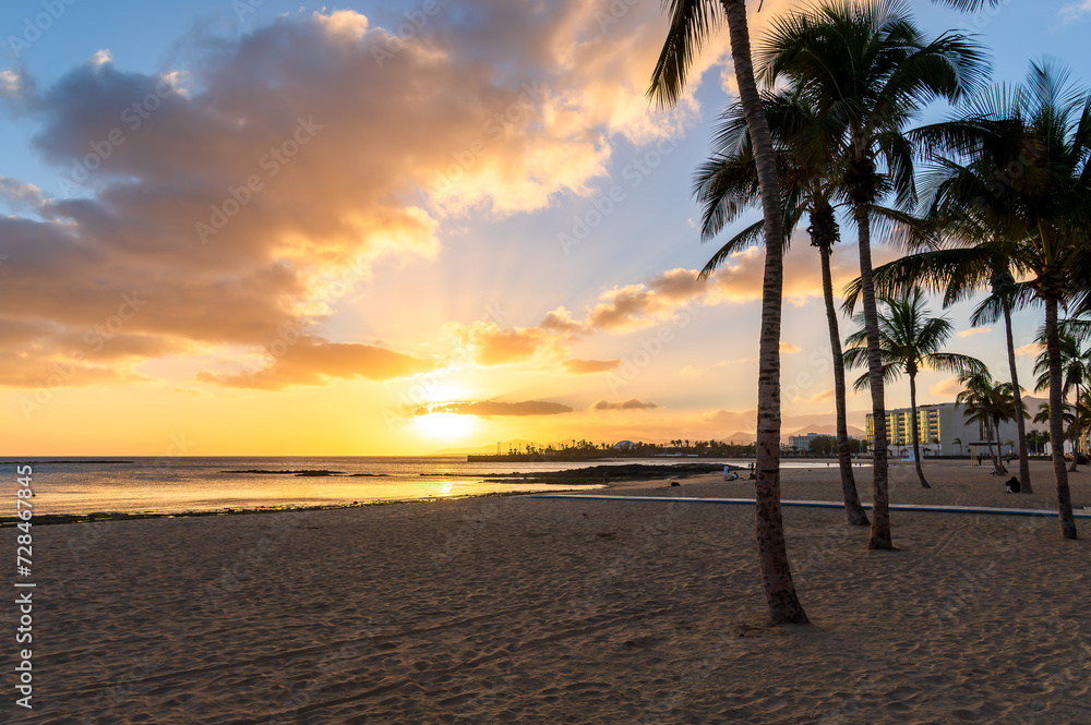 Immerse in the tranquil beauty of Playa del Reducto, Arrecife - a golden sand oasis with calm seas, perfect for family fun and sunset strolls in Lanzarote.