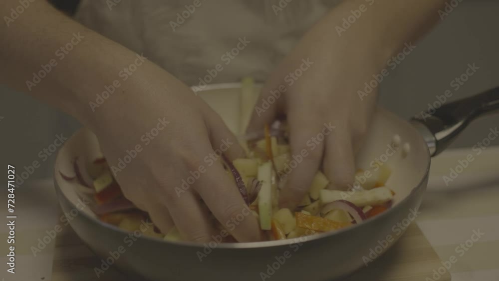 Chef cooking chopped vegetables Chef cooking chopped vegetables
