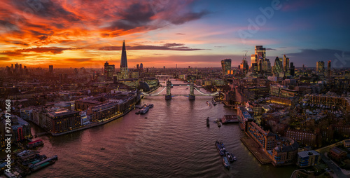 Panoramic aerial view of the London skyline with Tower Bridge, River Thames, City and Elephant and castle, during a fiery sunset