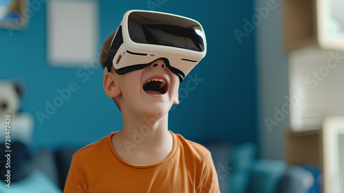 Excited Child Wearing VR Headset at Home. Joyful boy experiencing virtual reality with a headset in a vibrant blue room, expressing amazement.  © phairot
