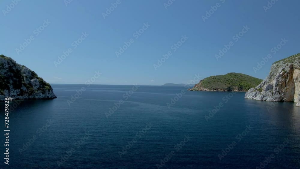 Cinematic backwards moving 4K drone clip over the tropical blue waters of Toroni in Chalkidiki Cinematic backwards moving 4K drone clip over the tropical blue waters of Toroni in Chalkidiki