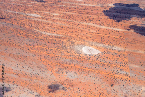 little pan and dune stripes in Kalahari, west of Stampriet, Namibia photo