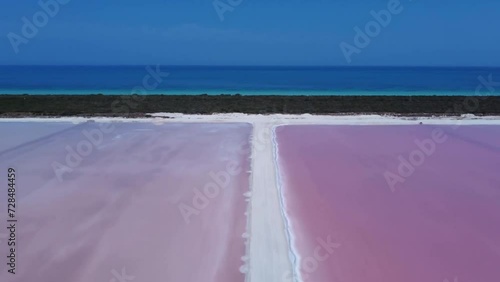 Aerial view of pink salt lakes and Caribbean sea at Las Coloradas in Mexico.  photo