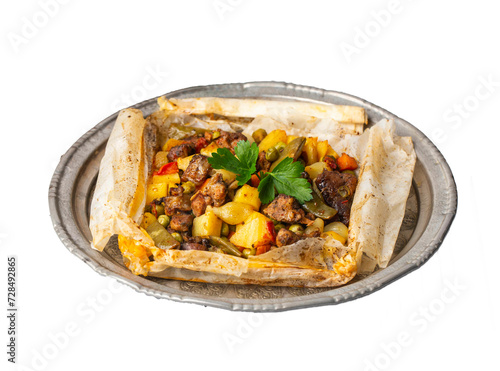 Traditional Turkish food; Meat with vegetables wrapped in greaseproof paper, kebab (Turkish name; Sebzeli kagit kebabi)