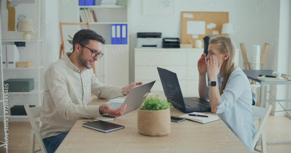 Interior Designers Working At Desk In Office Planning Interior Design. Interior Designers Working At Desk In Office Planning Interior Design.