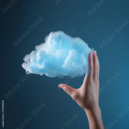 Creative Concept of a Human Hand touching a Fluffy Cloud