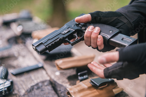 sports shooting instructor check your weapons close-up