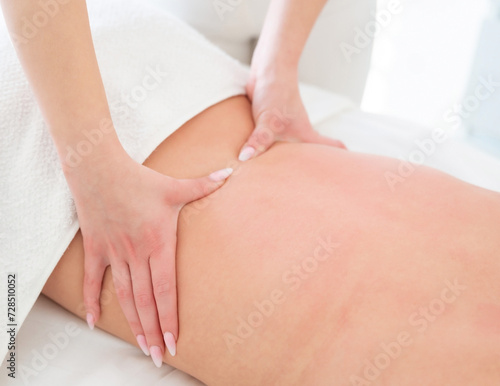 Massaging a woman in the spa