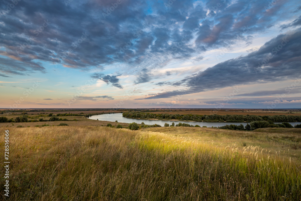 Magical autumn landscape with river and sunset sky Magical autumn landscape with river and sunset sky