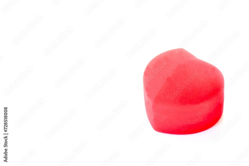 close up of red velvet ring box in heart shape arranging on white background