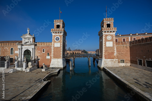 Entrance in the Arsenale di Venezia is a historic shipyard in the lagoon city of Venice, Veneto, Italy photo