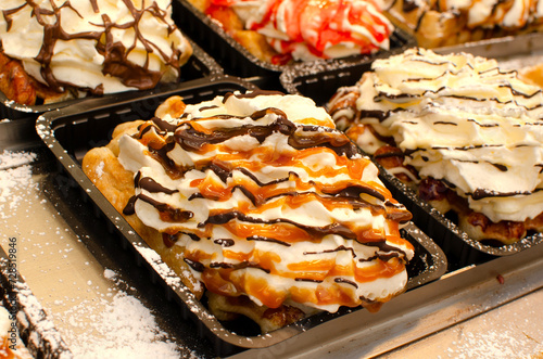 Belgium waffles with whipped cream and candy