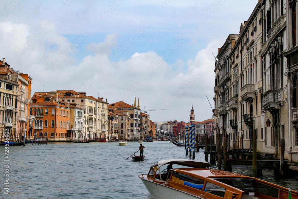 A Gondola Ride in Venice. Gondoliers On the Grand Canal. Venice Travel - obrazy, fototapety, plakaty 
