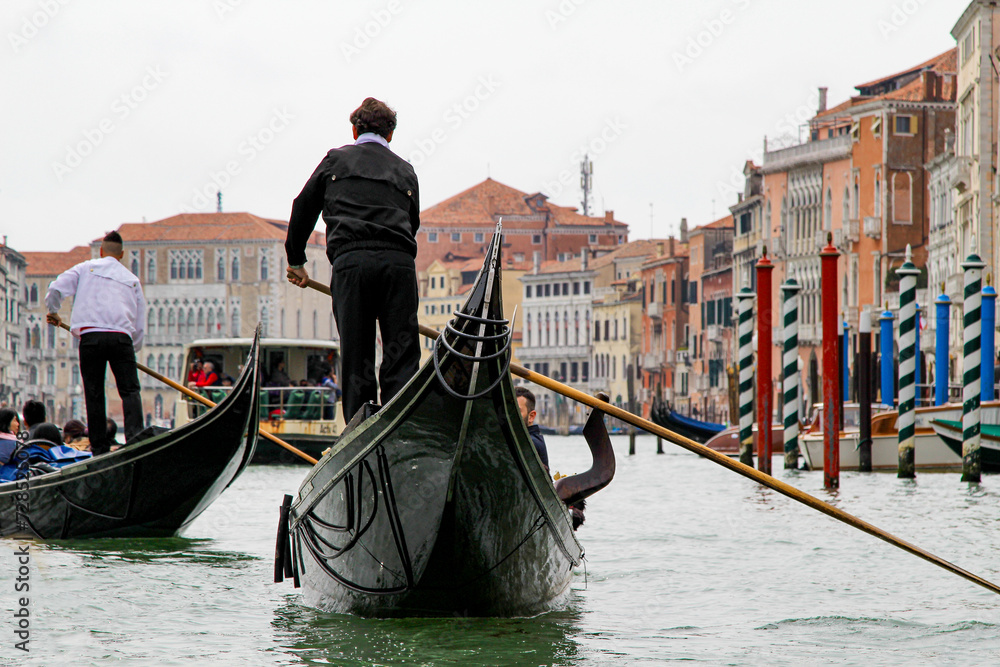 A Gondola Ride in Venice. Gondoliers On the Grand Canal. Venice Travel - obrazy, fototapety, plakaty 