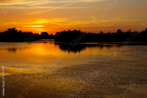 Orange sunset over the lake just before dusk