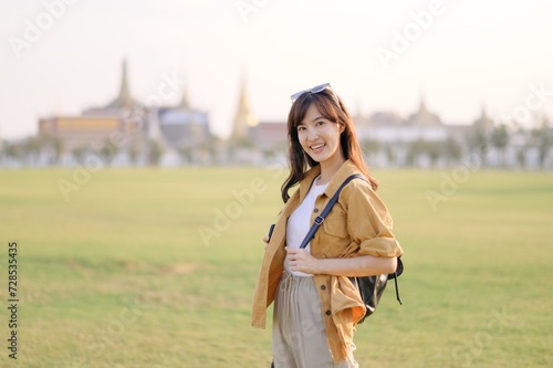 A Traveler Asian woman in her 30s exploring Wat Pra Kaew. From stunning architecture to friendly locals, she cherishes every moment, capturing it all in her heart and camera for years to come.