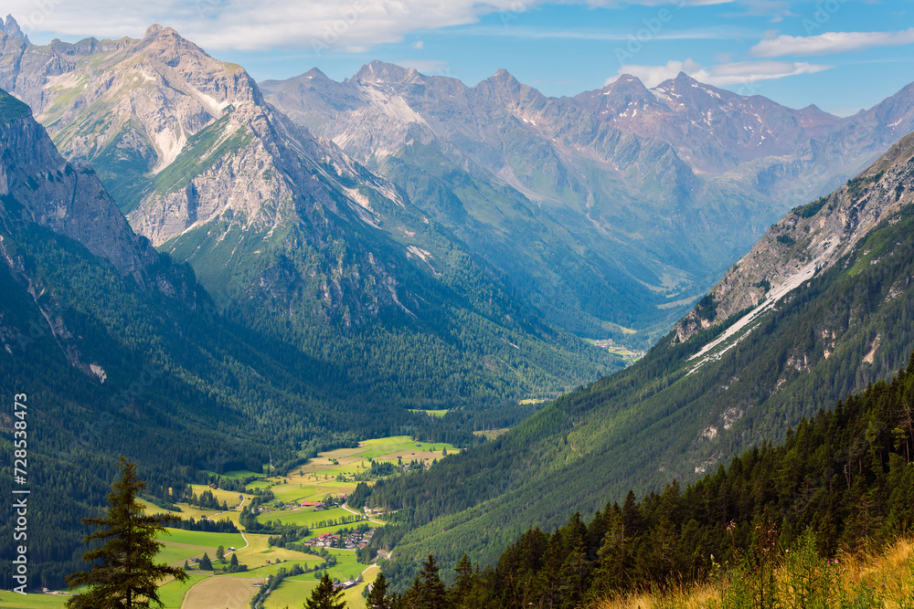 A beautiful alpine valley lit by the sun. Gschnitztal valley in summer, Tyrol, Austria. A beautiful alpine valley lit by the sun. Gschnitztal valley in summer, Tyrol, Austria.