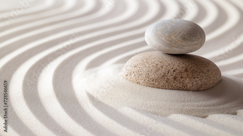 Zen stones with lines in the sand harmony and peace spa background. Therapy concept. 