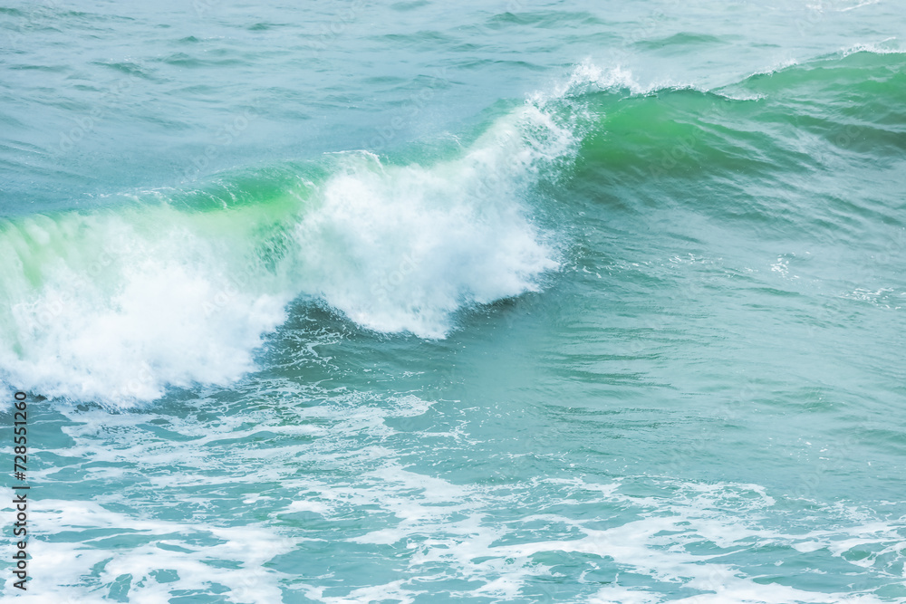 Wave splashing close-up. Crystal clear sea water, in the ocean in San Francisco Bay, blue water, pastel colors. Wave splashing close-up. Crystal clear sea water, in the ocean in San Francisco Bay, blue water, pastel colors.