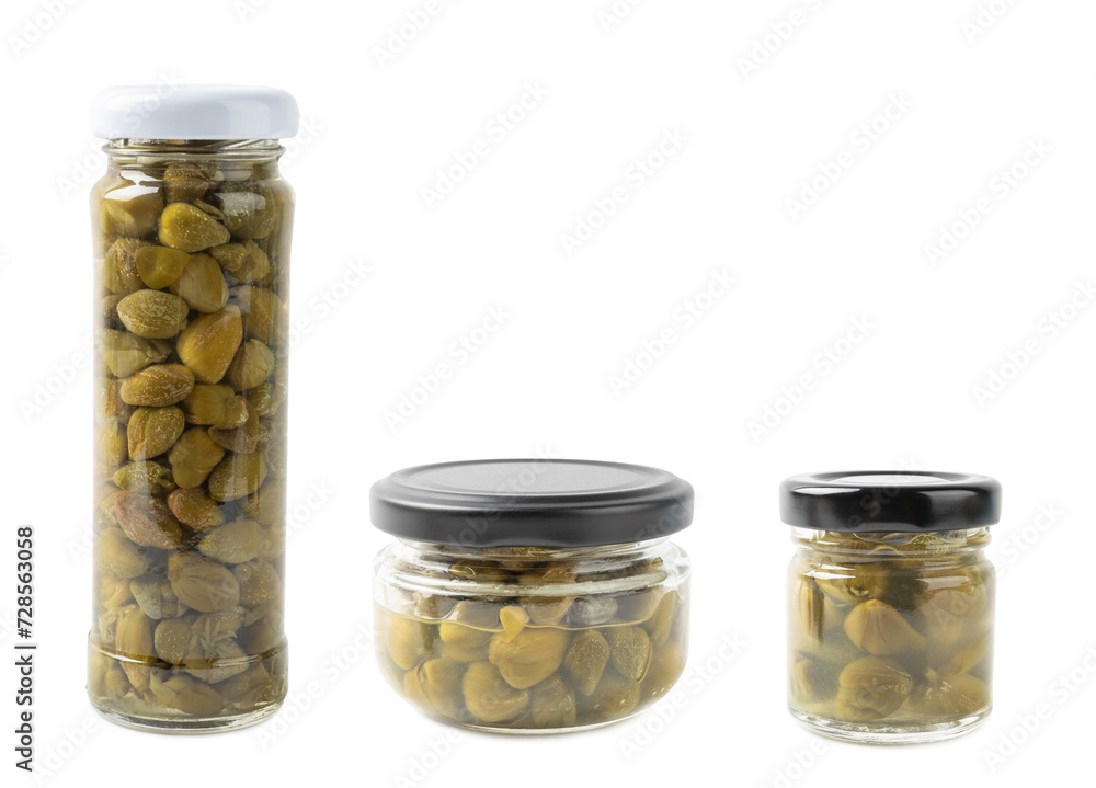 Capers in a glass jar isolated on a white background. Marinated caper buds, small salted capparis in bowl, fermented food, pickled capers group.Organic spices and seasonings. Capers in a glass jar isolated on a white background. Marinated caper buds, small salted capparis in bowl, fermented food, pickled capers group.Organic spices and seasonings.