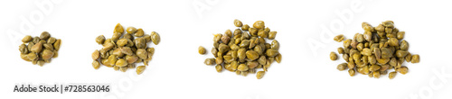 Capers isolated on white background. Marinated caper buds, small salted capparis in bowl, fermented food, pickled capers group.Organic spices and seasonings. photo