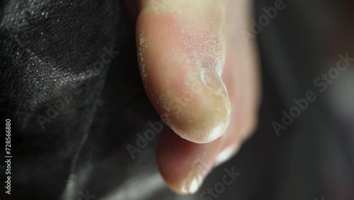 Doctor removes onycholysis on a toenail after damaging with tight shoes or using gel-lacquer. Professional hardware pedicure using electric machine. Patient on medical pedicure procedure photo