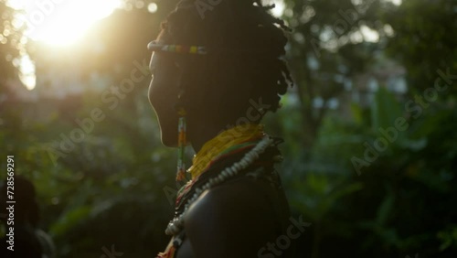 Close-Up Of Beautiful African Woman From Karamojong Tribe In The Sunlight At Sunset photo